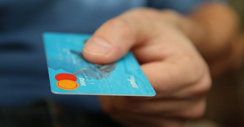 Corporate Credit Card - Person Holding Debit Card
