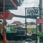 Local Tours - Woman with motorbike at gas station