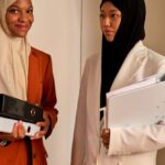 Dress Codes - Muslim Women in Hijabs Standing in Office Interior