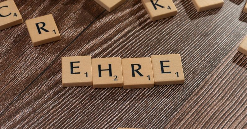 Reputation - The word ehr on a wooden table with scrabble letters
