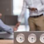 Time Zones - Gray and White Clock on Wooden Table