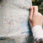Itineraries - A Person Holding a Map