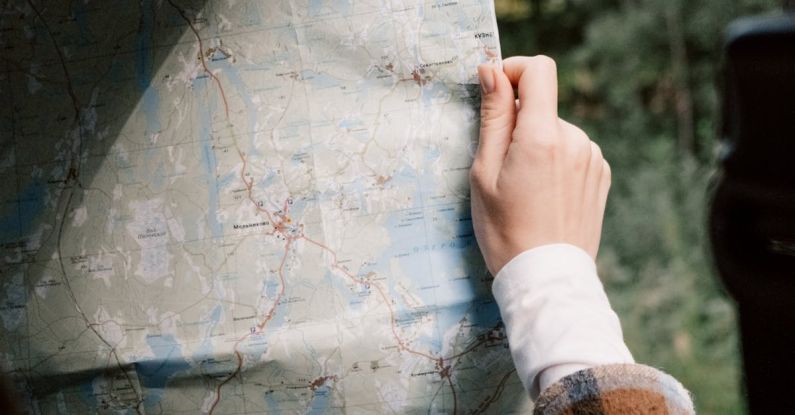 Itineraries - A Person Holding a Map