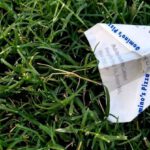 Receipts - Receipt Folded Into Paper Plane on Grass