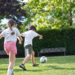 Experiential Activities - Young Kids Playing Football on the Field