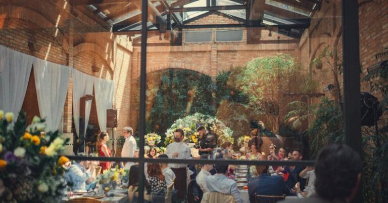 Dining Venues - Wedding Guests Sitting the the Tables and Eating