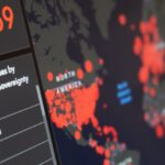 Reporting Software - Blurred world map with total number of people infected by coronavirus and statistics of various countries