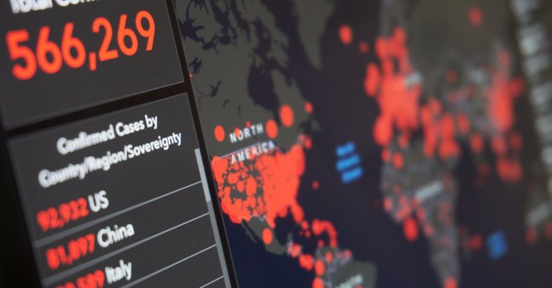 Reporting Software - Blurred world map with total number of people infected by coronavirus and statistics of various countries