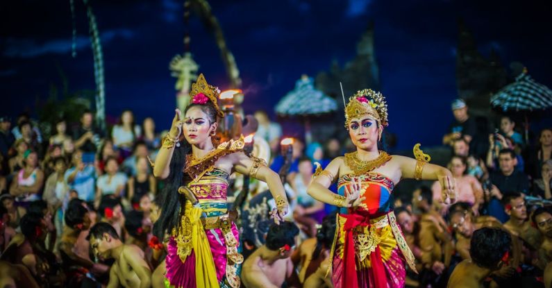 Traditions - Two Women Dancing While Wearing Dresses at Night Time