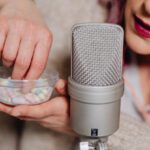 Topics - A Woman Holding a Cup of Capsules